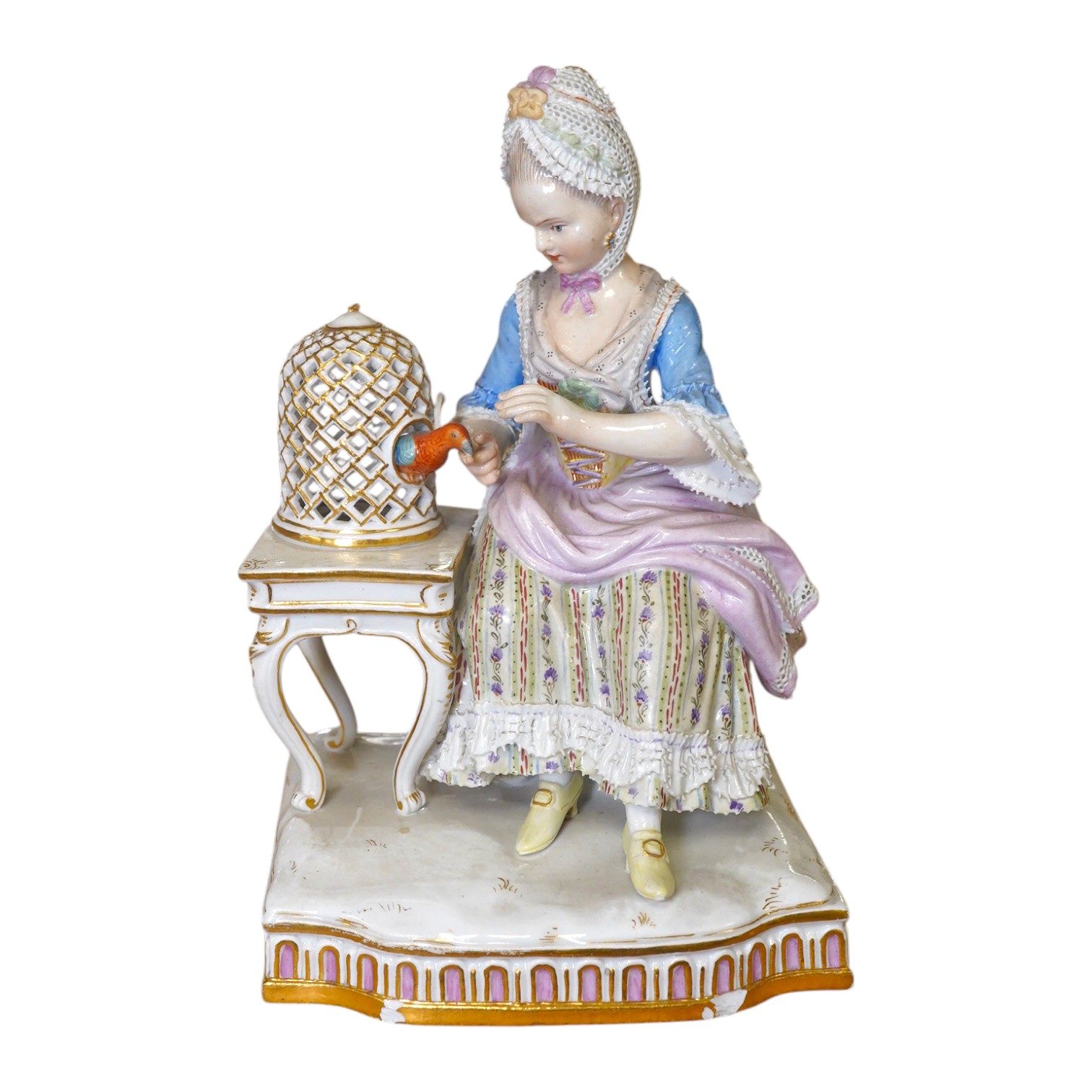 A late 19th century Meissen porcelain figure, ‘Sentiment’ modelled as a young woman seated with a parrot in a gilded cage, 15cm high. Condition - fair, chipping